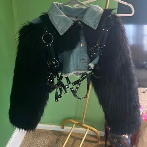 Size small denim jacketed with faux fur sleeves and leather and metal trim.
